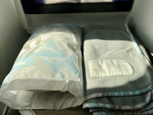 pillow and blanket in Hawaiian Airlines first class